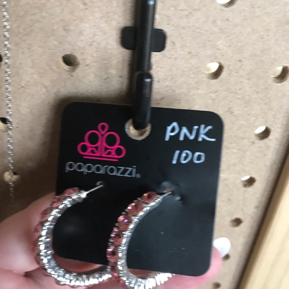 Pink rhinestone hoop earrings.